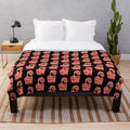 Soft and cozy pink plush blanket with a vibrant pop art inspired pattern
