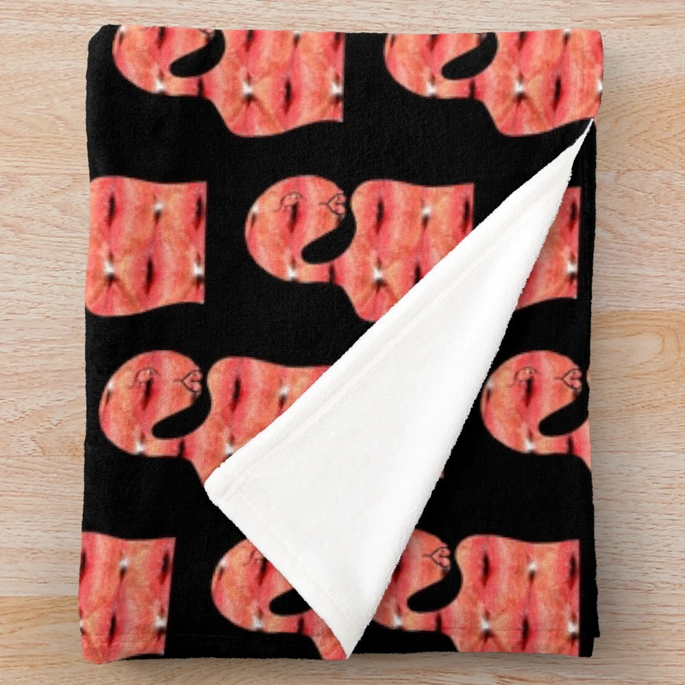 Soft and cozy pink plush blanket with a vibrant pop art inspired pattern