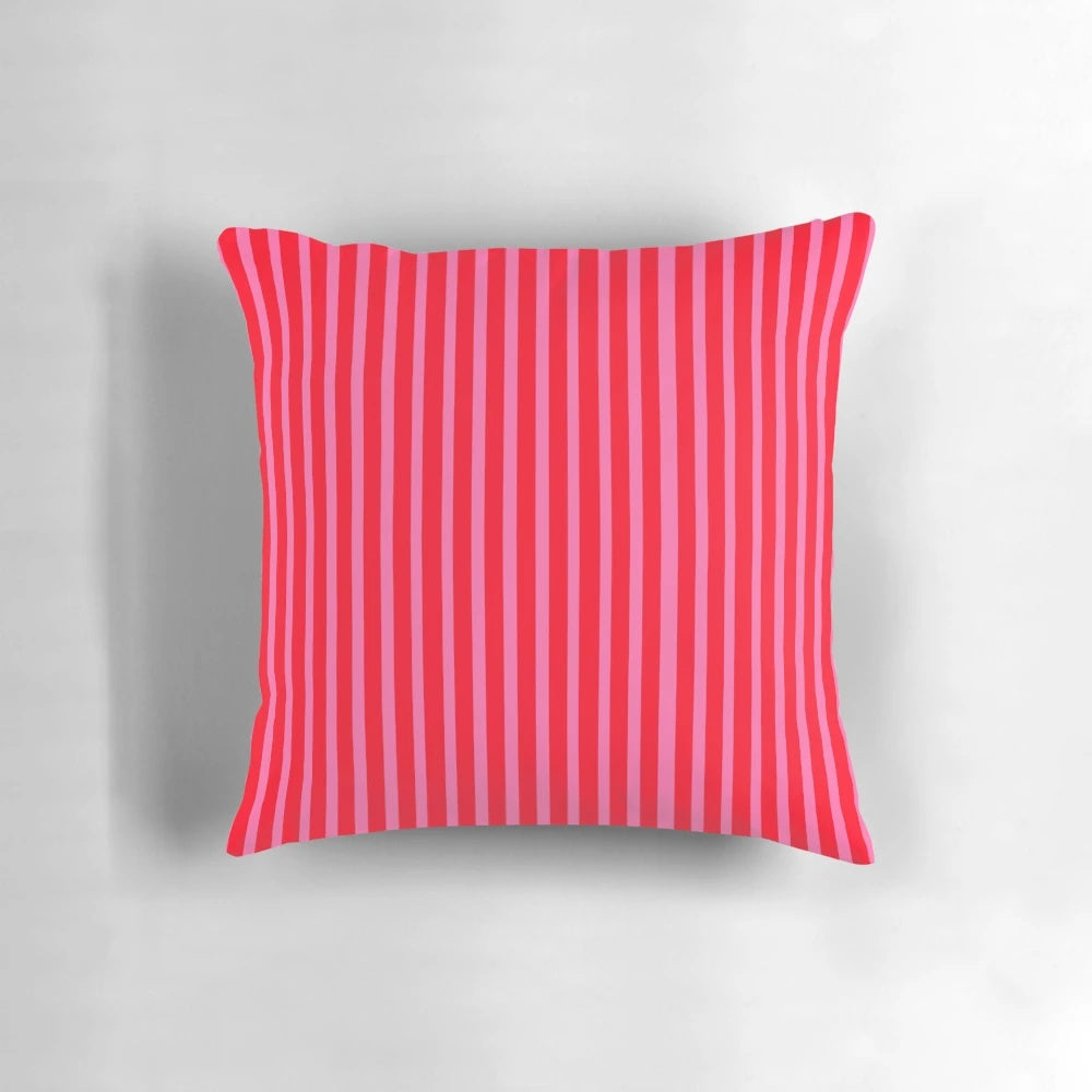 Bright pink and red striped throw pillow with modern, vertical lines