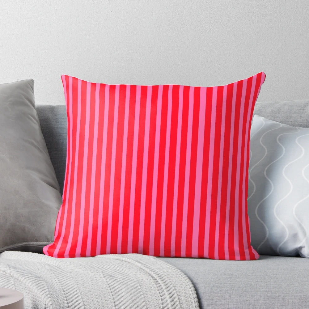 Bright pink and red striped throw pillow with modern, vertical lines