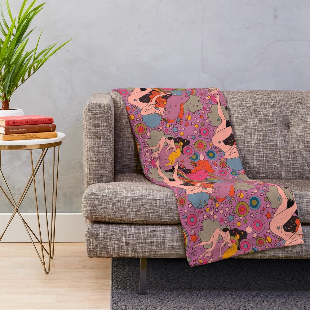 Cozy and vibrant pink and violet galaxy-themed plush blanket