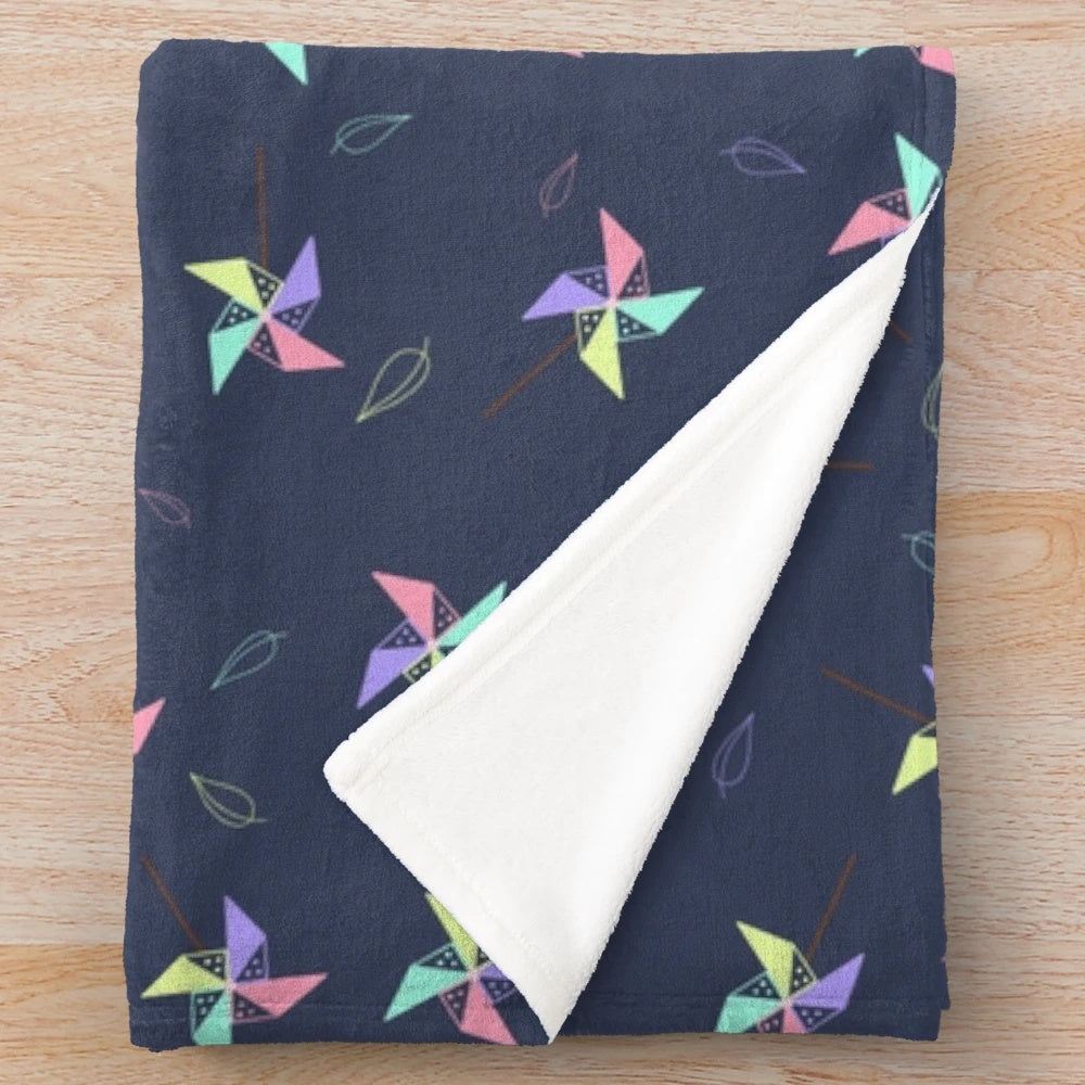 Pinwheel patterned plush blanket for cozy home decor