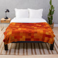Pixelated lava pattern plush blanket with vibrant red and orange hues