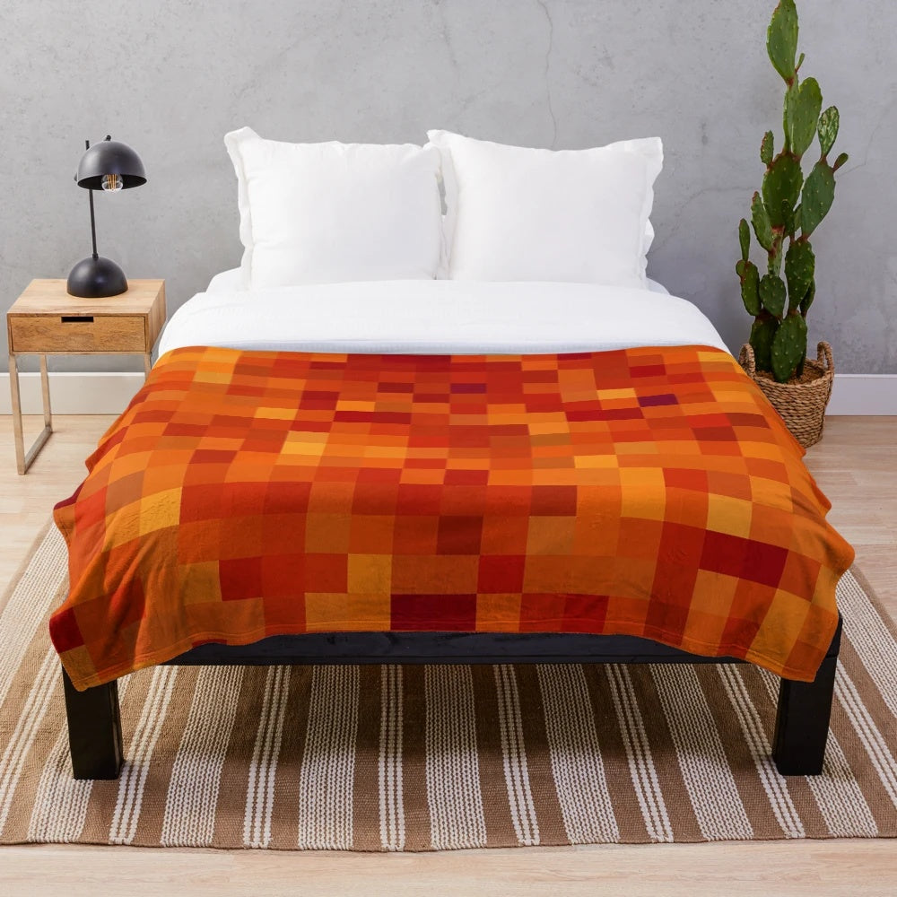 Pixelated lava pattern plush blanket with vibrant red and orange hues