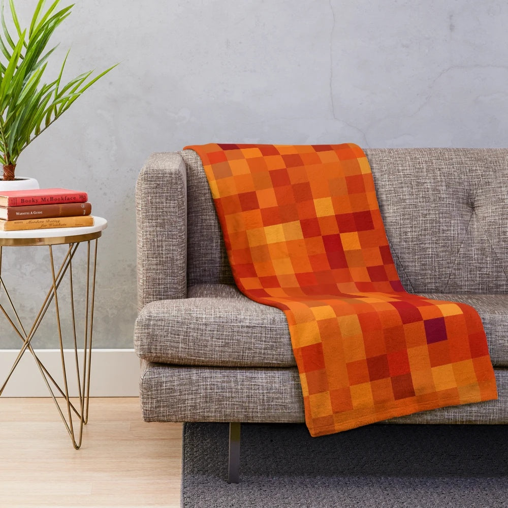 Pixelated lava pattern plush blanket with vibrant red and orange hues