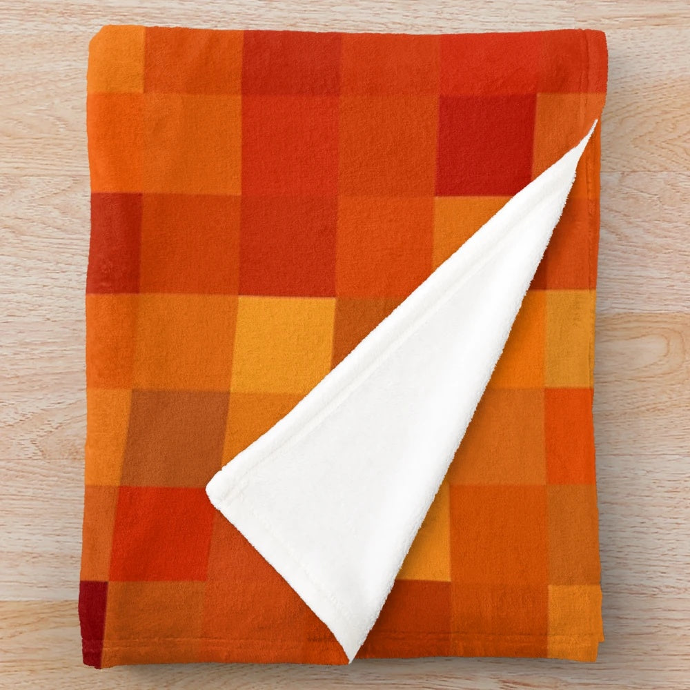 Pixelated lava pattern plush blanket with vibrant red and orange hues