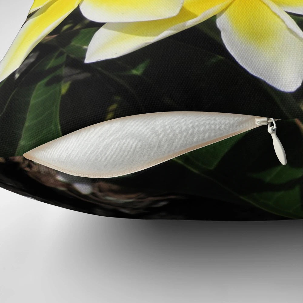 Soft, decorative pillow featuring a vibrant plumeria flower from the tropical island of Maui, Hawaii