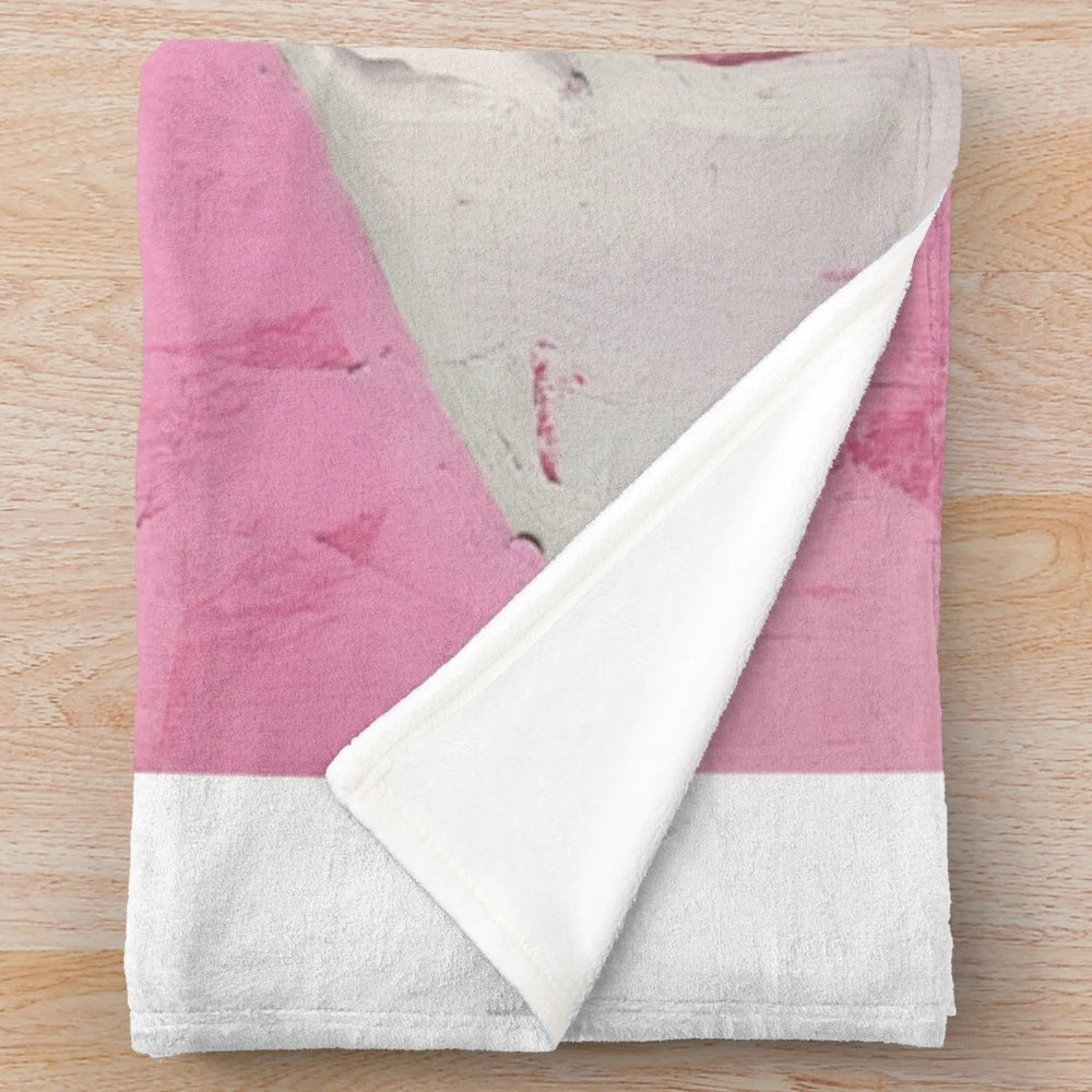 Colorful plush blanket featuring a vibrant South American-inspired design
