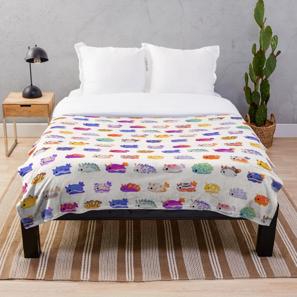 Plush blanket with colorful sea slug or nudibranch design