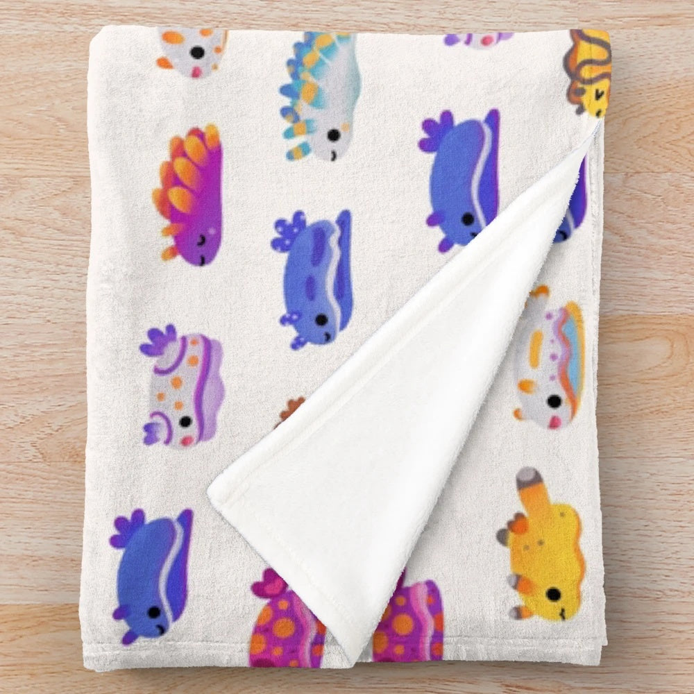 Plush blanket with colorful sea slug or nudibranch design
