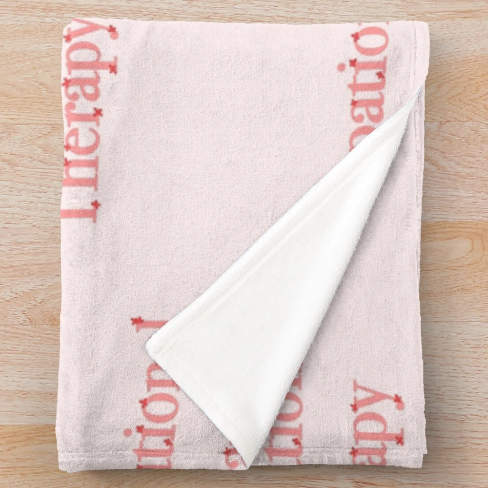 Pink and red plush blanket with floral design, ideal for occupational therapy and mental health