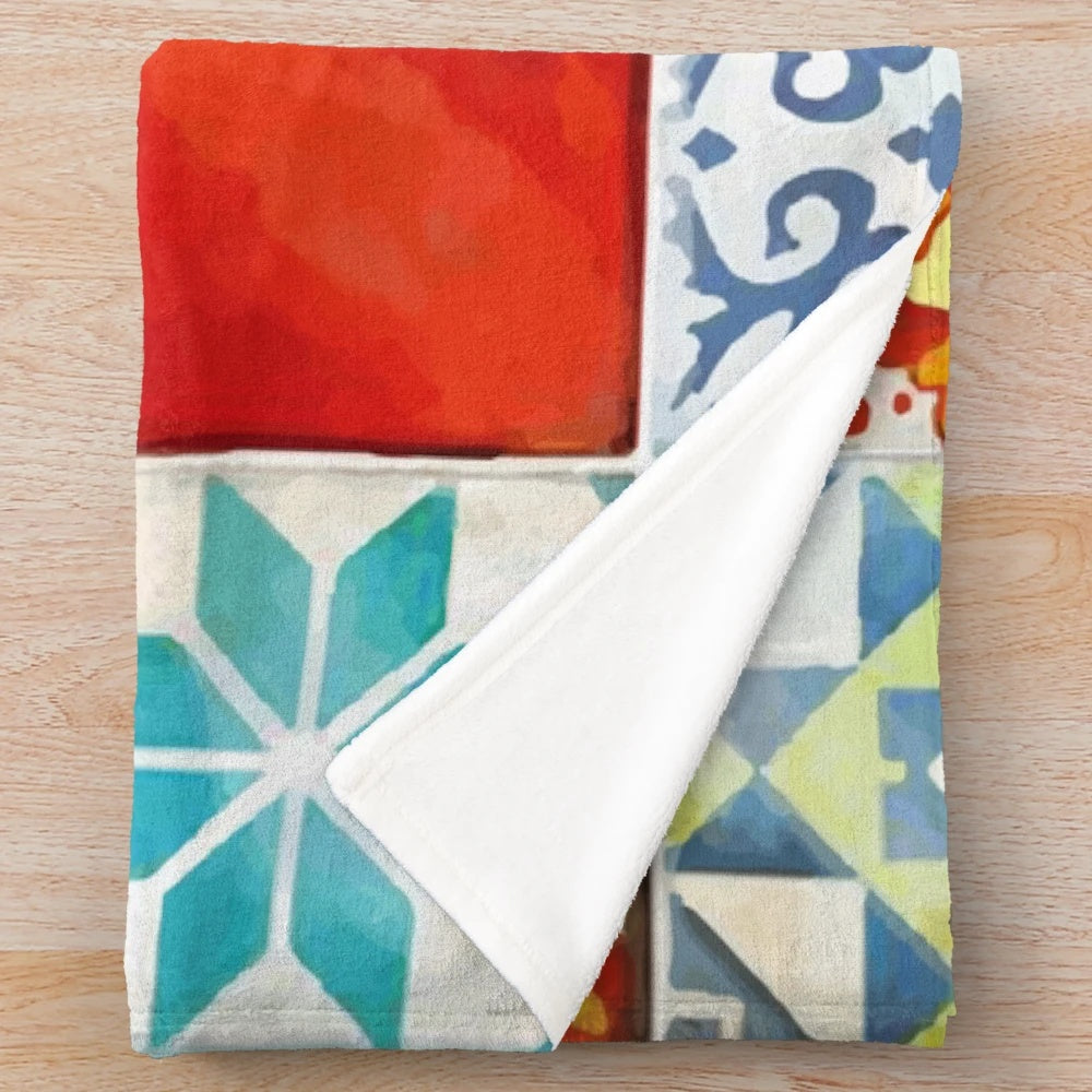 Colorful plush blanket featuring an abstract mosaic design inspired by azulejo tiles from the Azul board game