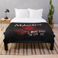 Colorful plush blanket featuring the band fourman's logo and tour graphics