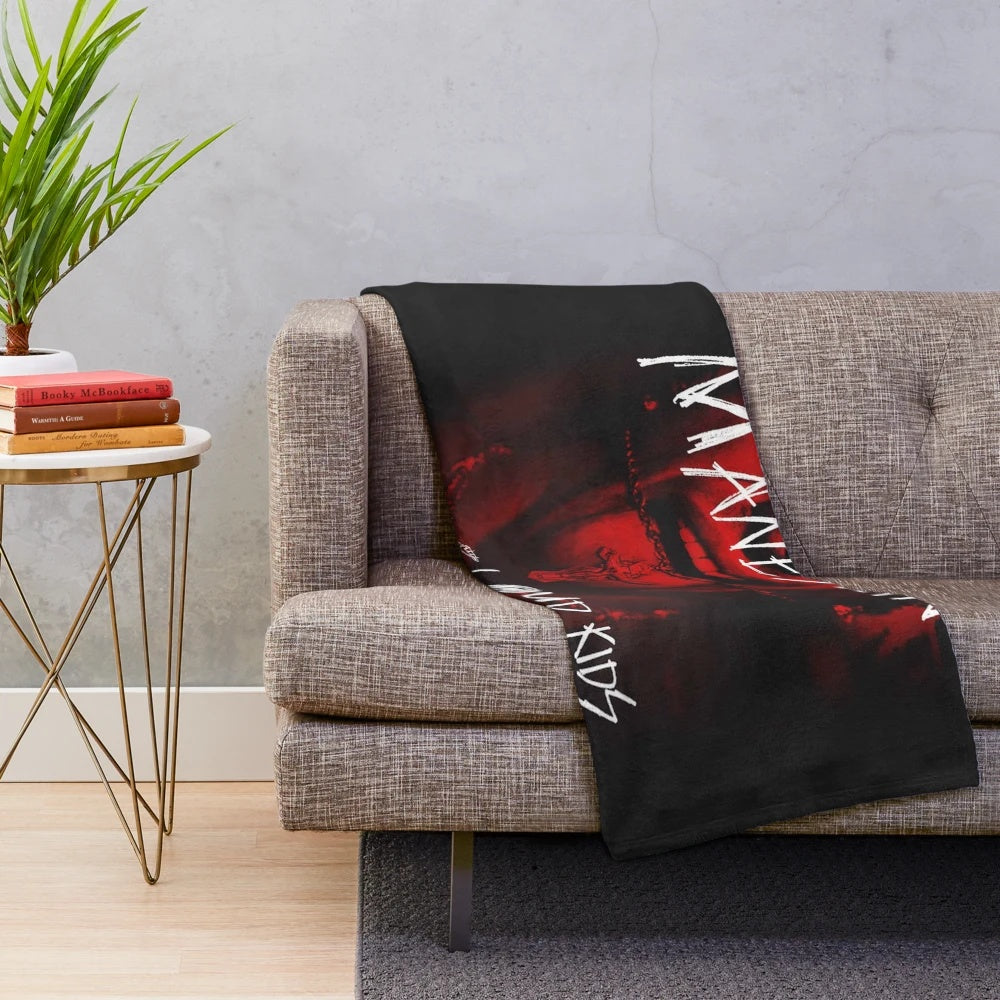 Colorful plush blanket featuring the band fourman's logo and tour graphics