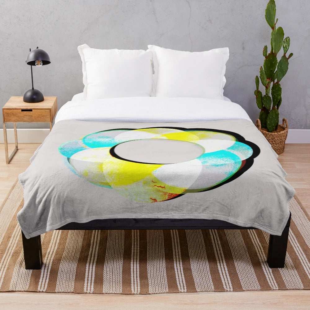 Colorful plush blanket featuring a vibrant, abstract mandala design