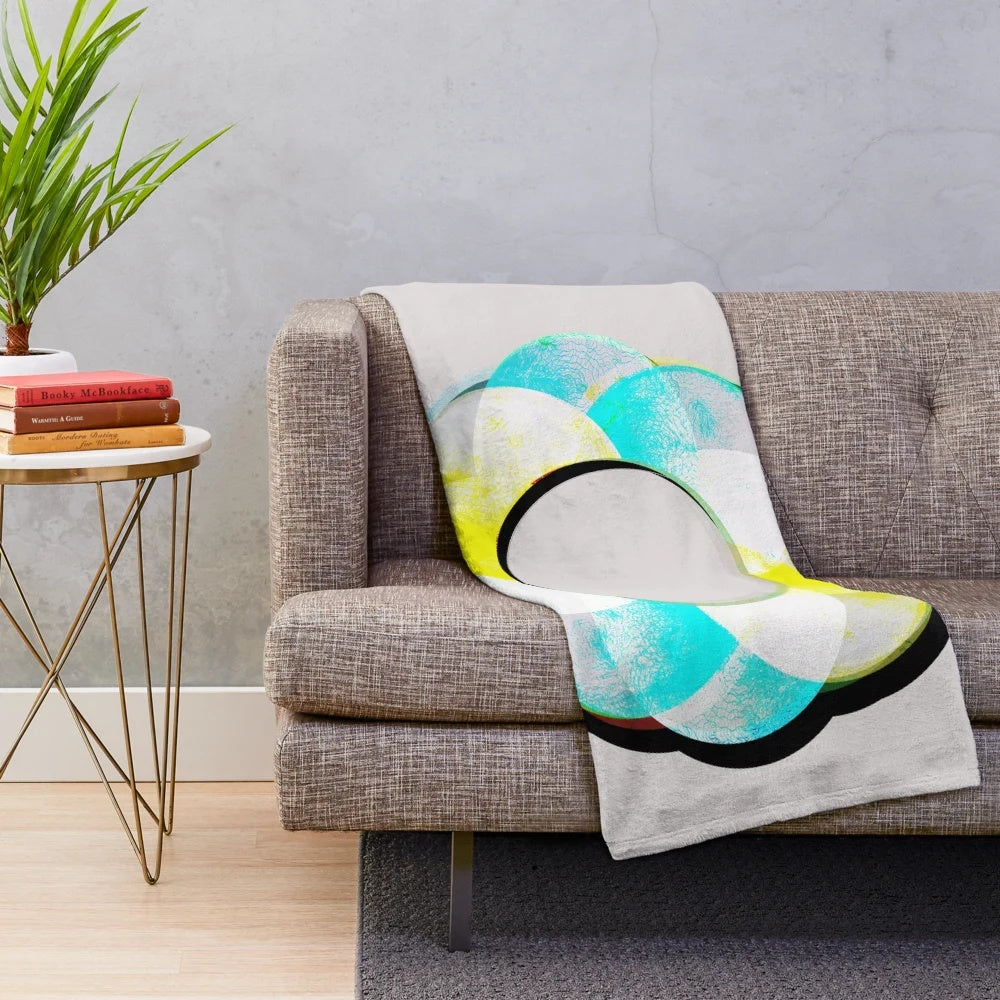 Colorful plush blanket featuring a vibrant, abstract mandala design