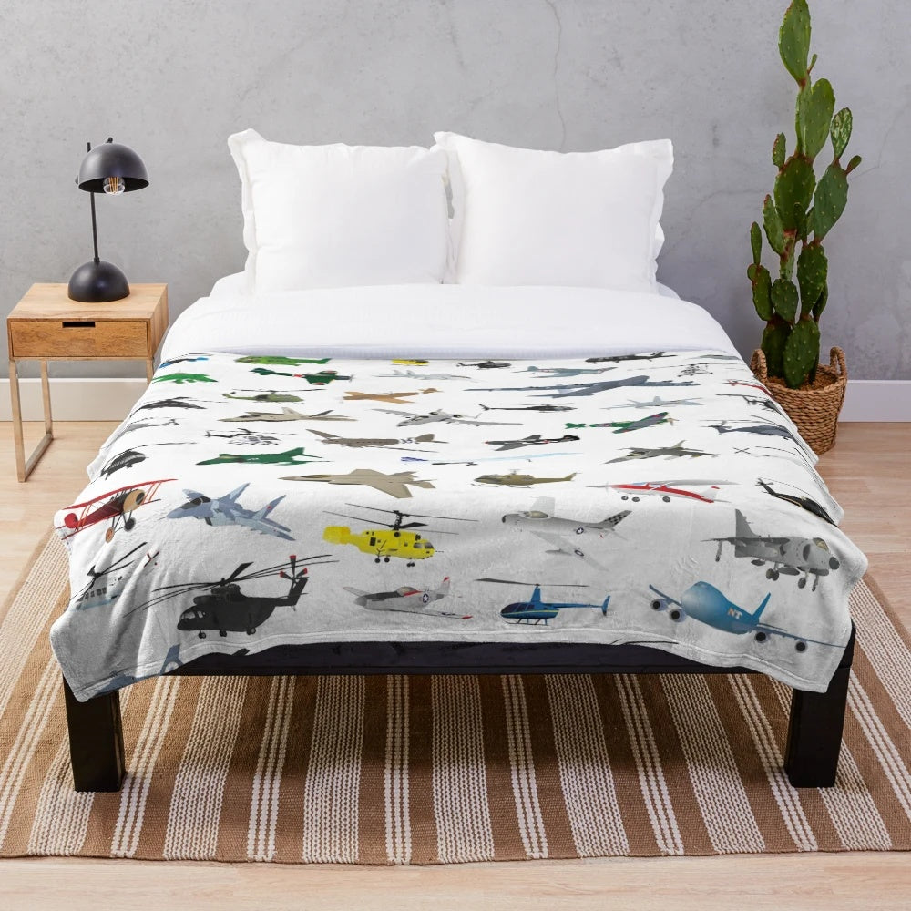 Colorful plush blanket featuring various aviation-themed patterns
