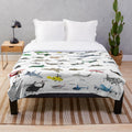 Colorful plush blanket featuring various aviation-themed patterns