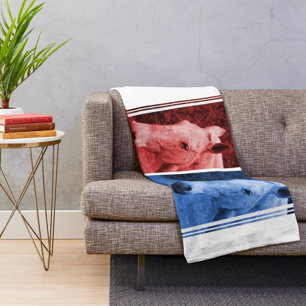 Soft, plush blanket featuring a blurred image of horses in red and blue