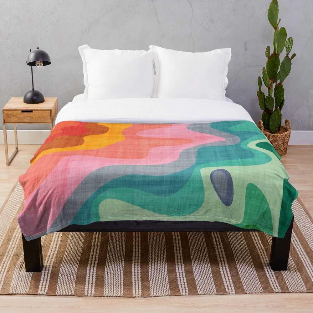 Colorful plush blanket with abstract rainbow pattern
