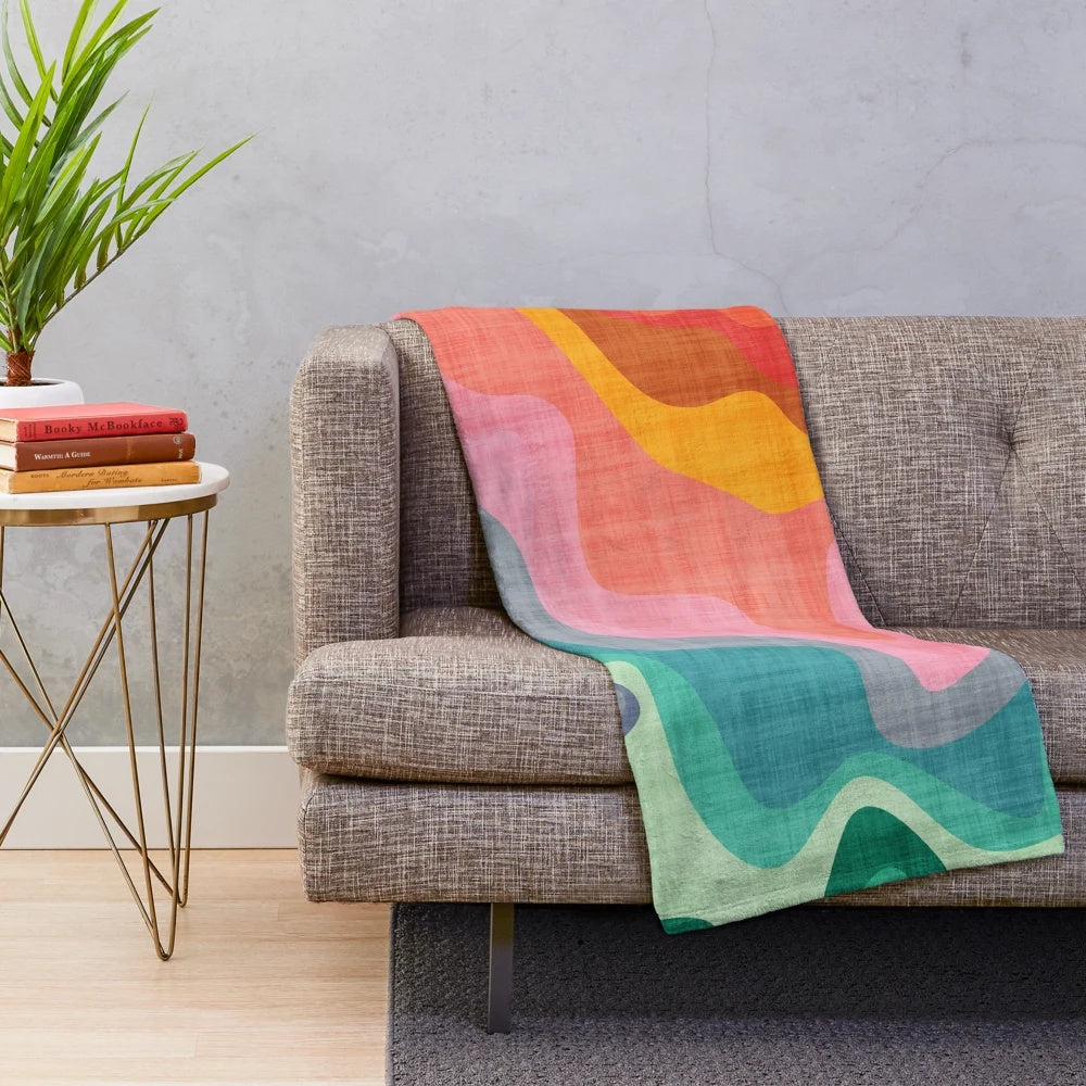 Colorful plush blanket with abstract rainbow pattern