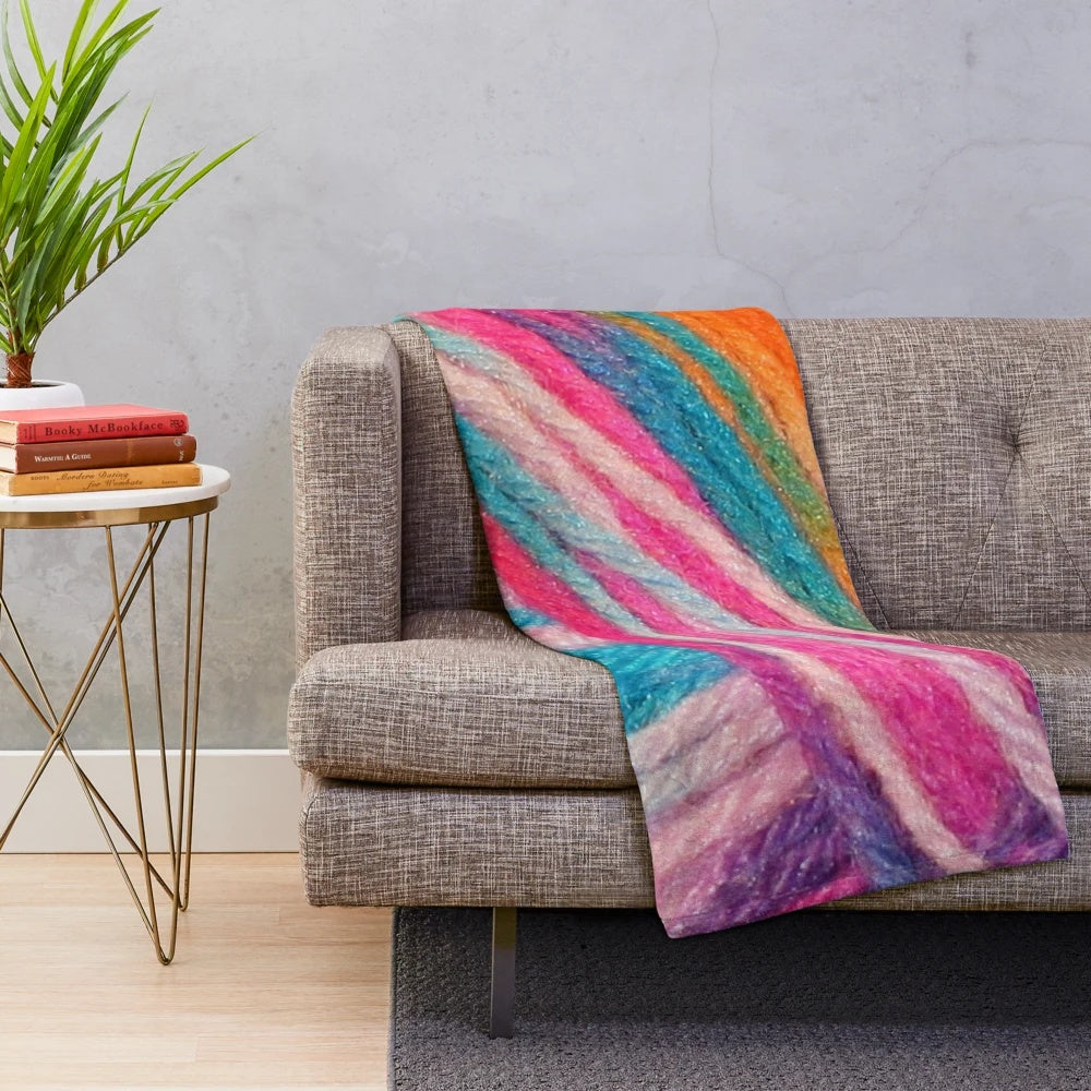 Colorful plush blanket made with bright yarn for crochet and knitting hobbyists