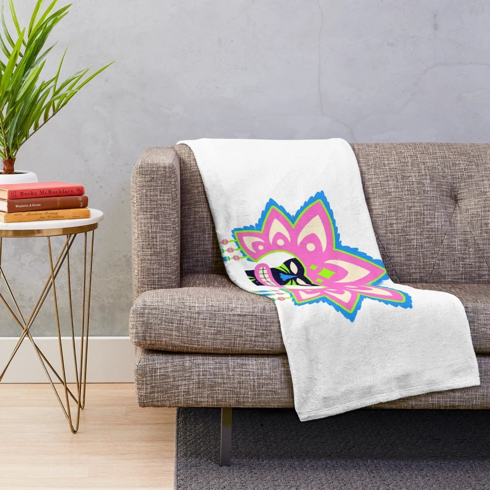 Plush blanket with colorful, vibrant, and geometric Ati-Atihan festival mask design
