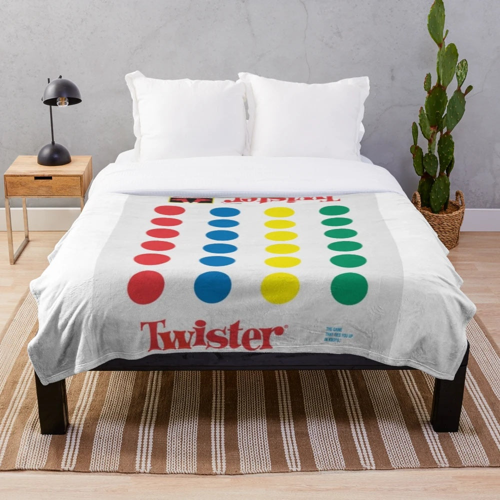 Colorful plush blanket with retro game-inspired polka dot and primary color pattern