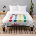Colorful plush blanket with retro game-inspired polka dot and primary color pattern