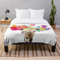 Colorful pop art giraffe design on a plush blanket