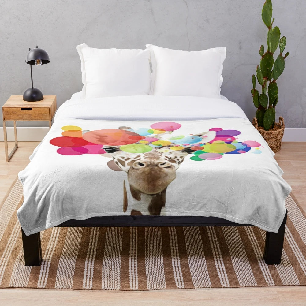 Colorful pop art giraffe design on a plush blanket