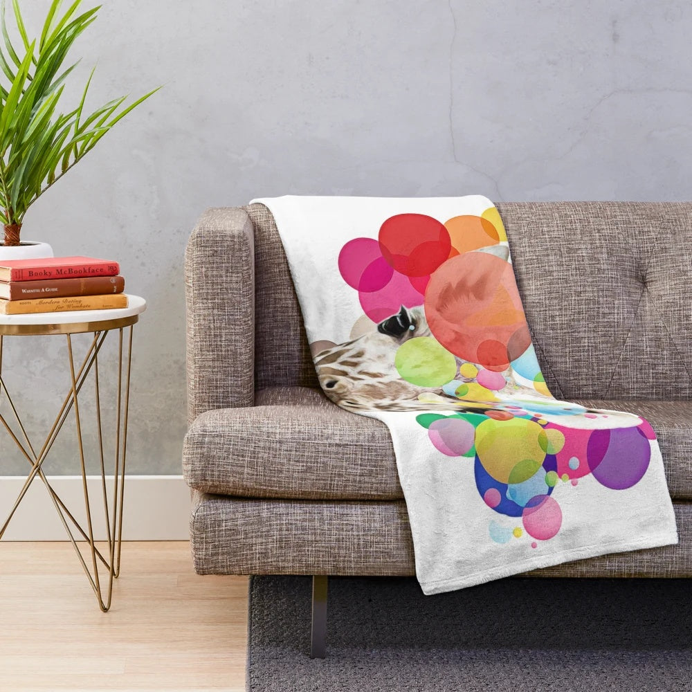 Colorful pop art giraffe design on a plush blanket