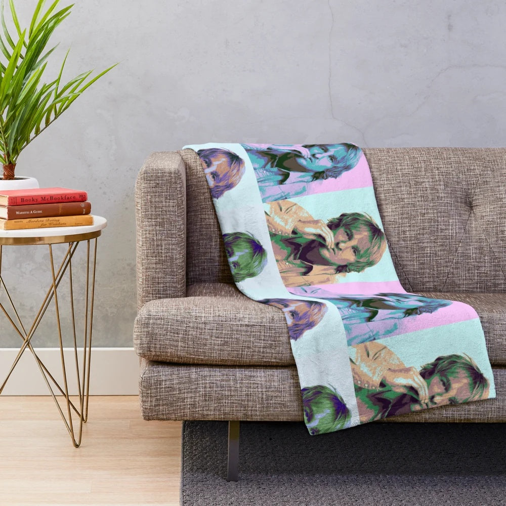 Colorful pop art-style portrait of actor Owen Wilson on a plush blanket