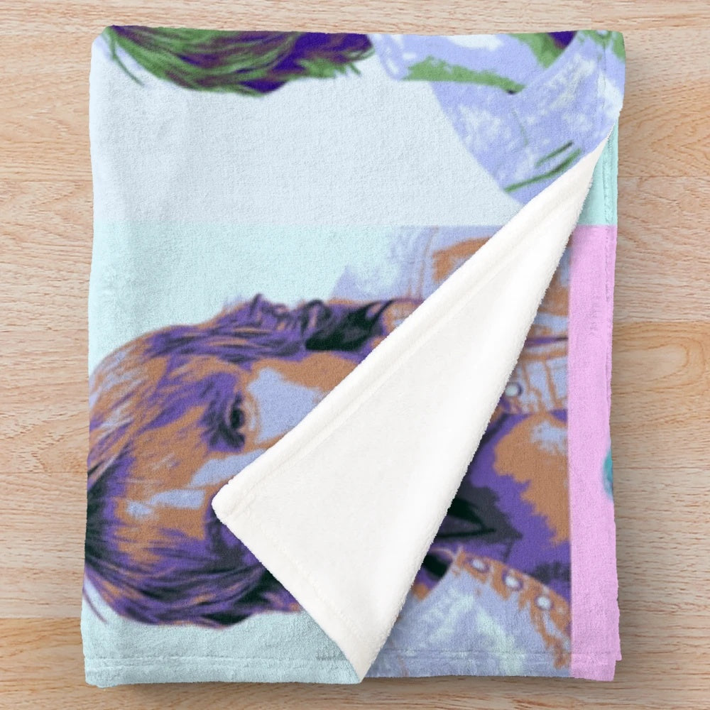 Colorful pop art-style portrait of actor Owen Wilson on a plush blanket