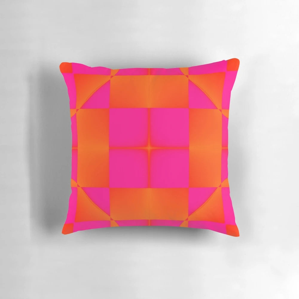 Vibrant pink and orange graphic pillow with squares and triangles