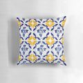 A pillow featuring a colorful pattern of blue and yellow Portuguese-inspired tiles.