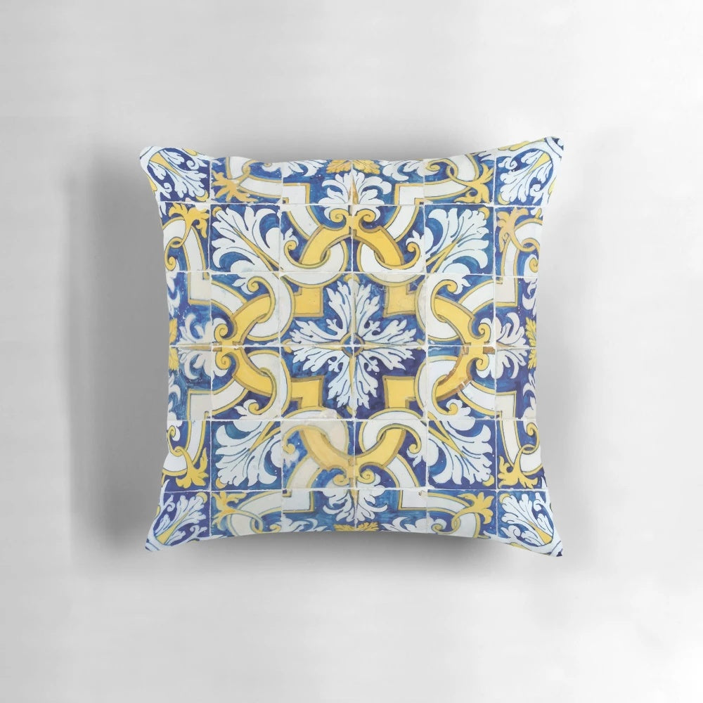 Decorative throw pillow featuring a colorful Portuguese tile pattern in blue and yellow