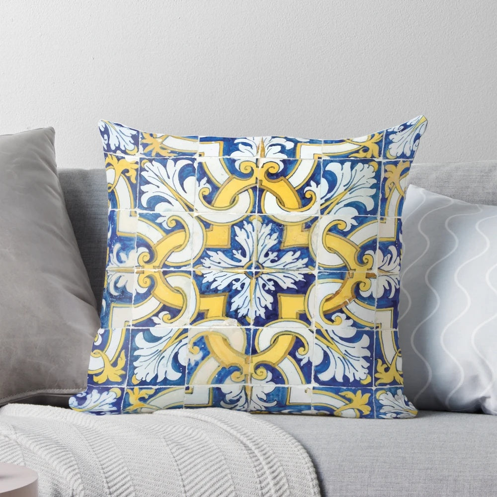 Decorative throw pillow featuring a colorful Portuguese tile pattern in blue and yellow