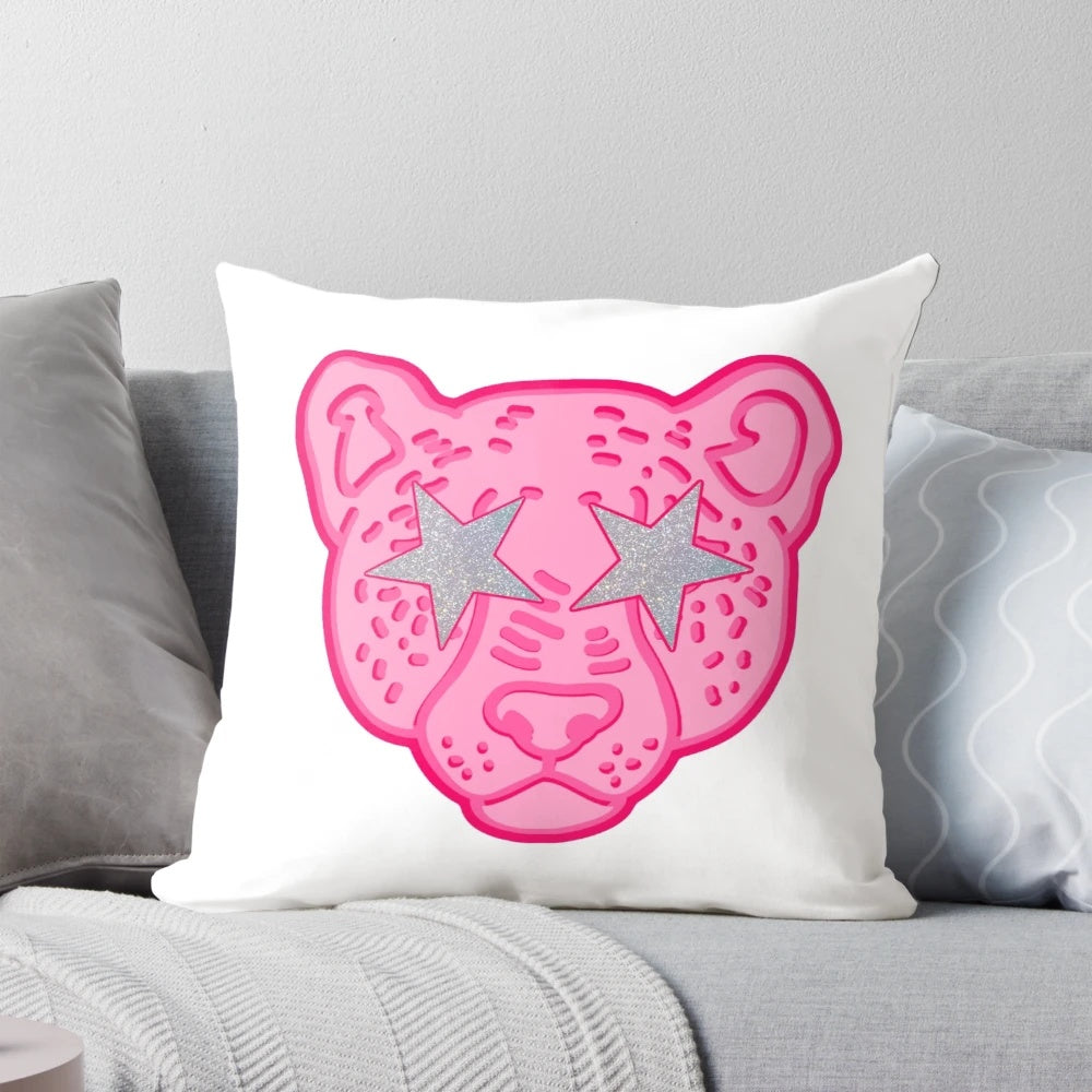 Closeup of a pink and colorful cheetah print pillow with a striking, eye-catching design.