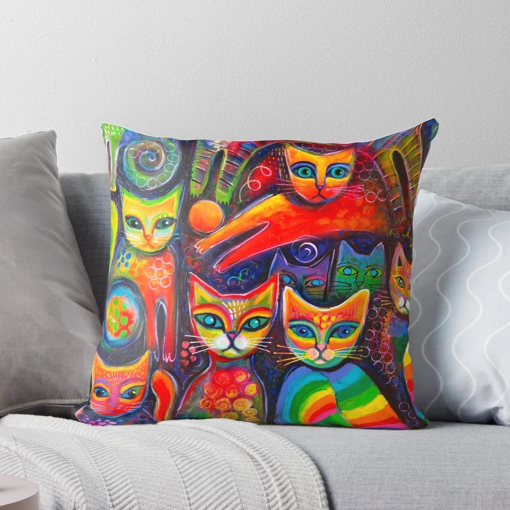 Colorful, psychedelic-inspired illustration of whimsical cats on a decorative pillow