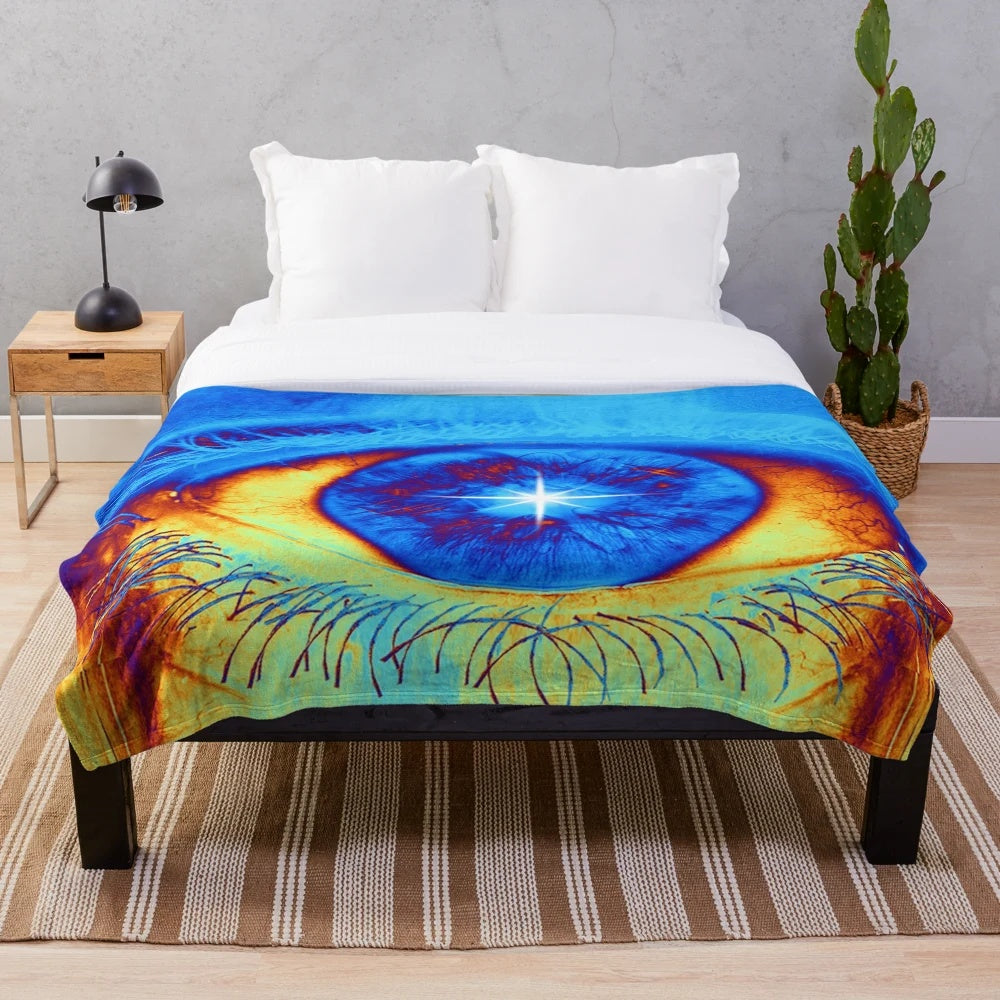 Psychedelic eye-shaped plush blanket with vibrant, abstract design