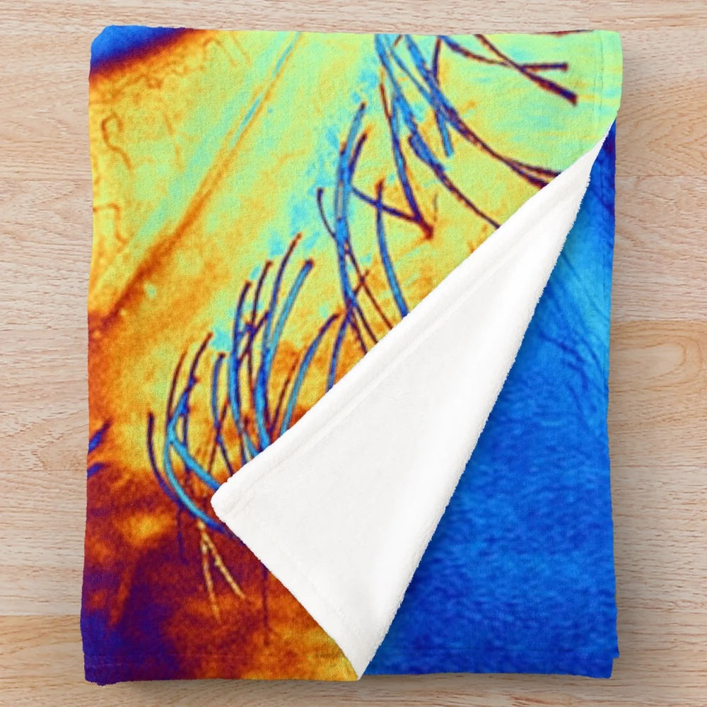 Psychedelic eye-shaped plush blanket with vibrant, abstract design