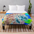 Colorful psychedelic plush blanket with trippy abstract patterns