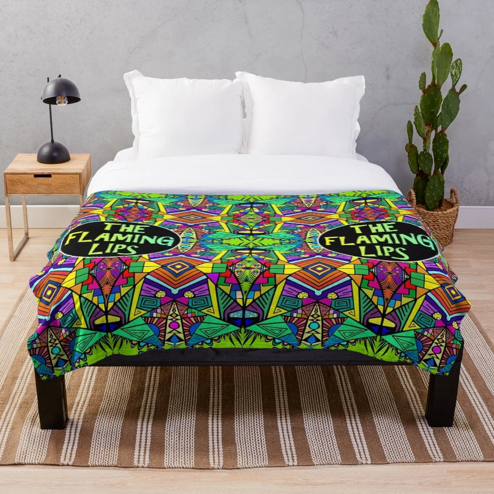 Vibrant psychedelic plush blanket featuring a colorful, trippy pattern inspired by the alternative music of The Flaming Lips.