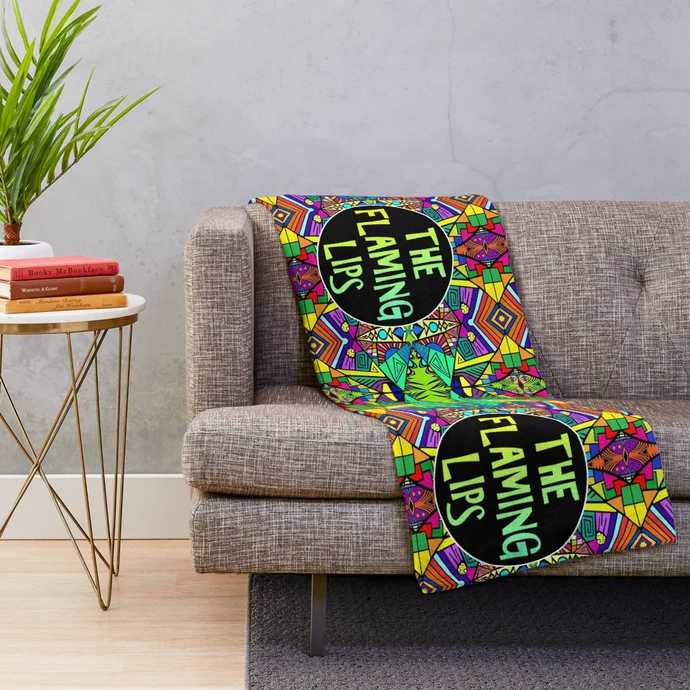 Vibrant psychedelic plush blanket featuring a colorful, trippy pattern inspired by the alternative music of The Flaming Lips.