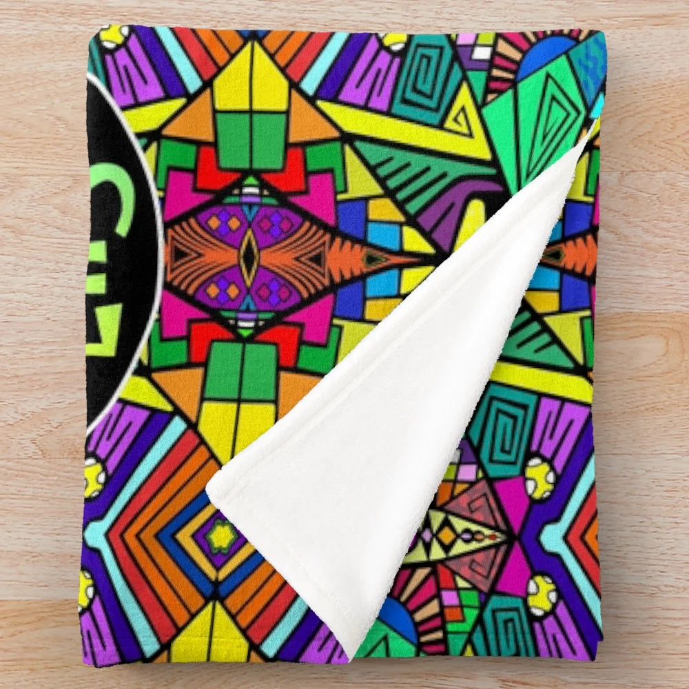 Vibrant psychedelic plush blanket featuring a colorful, trippy pattern inspired by the alternative music of The Flaming Lips.