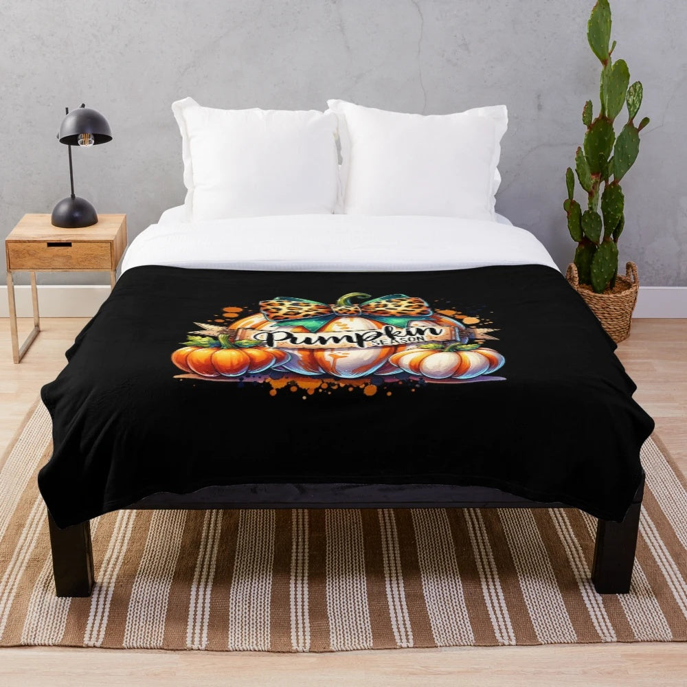 Cozy plush blanket featuring a whimsical watercolor pumpkin illustration in fall colors