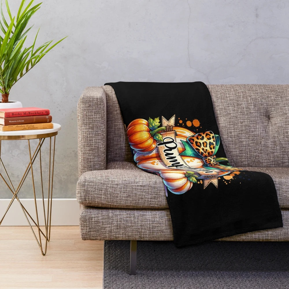 Cozy plush blanket featuring a whimsical watercolor pumpkin illustration in fall colors