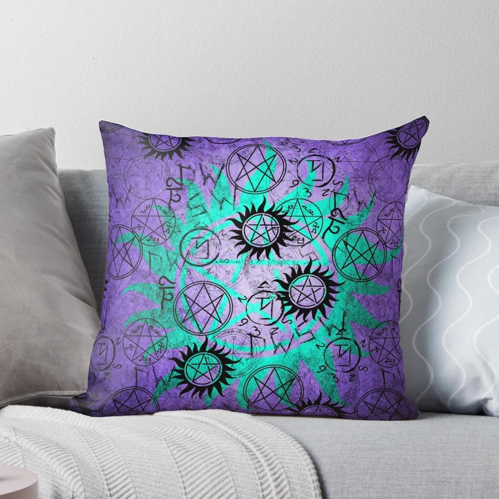 A set of three decorative pillows in vibrant purple and teal colors.