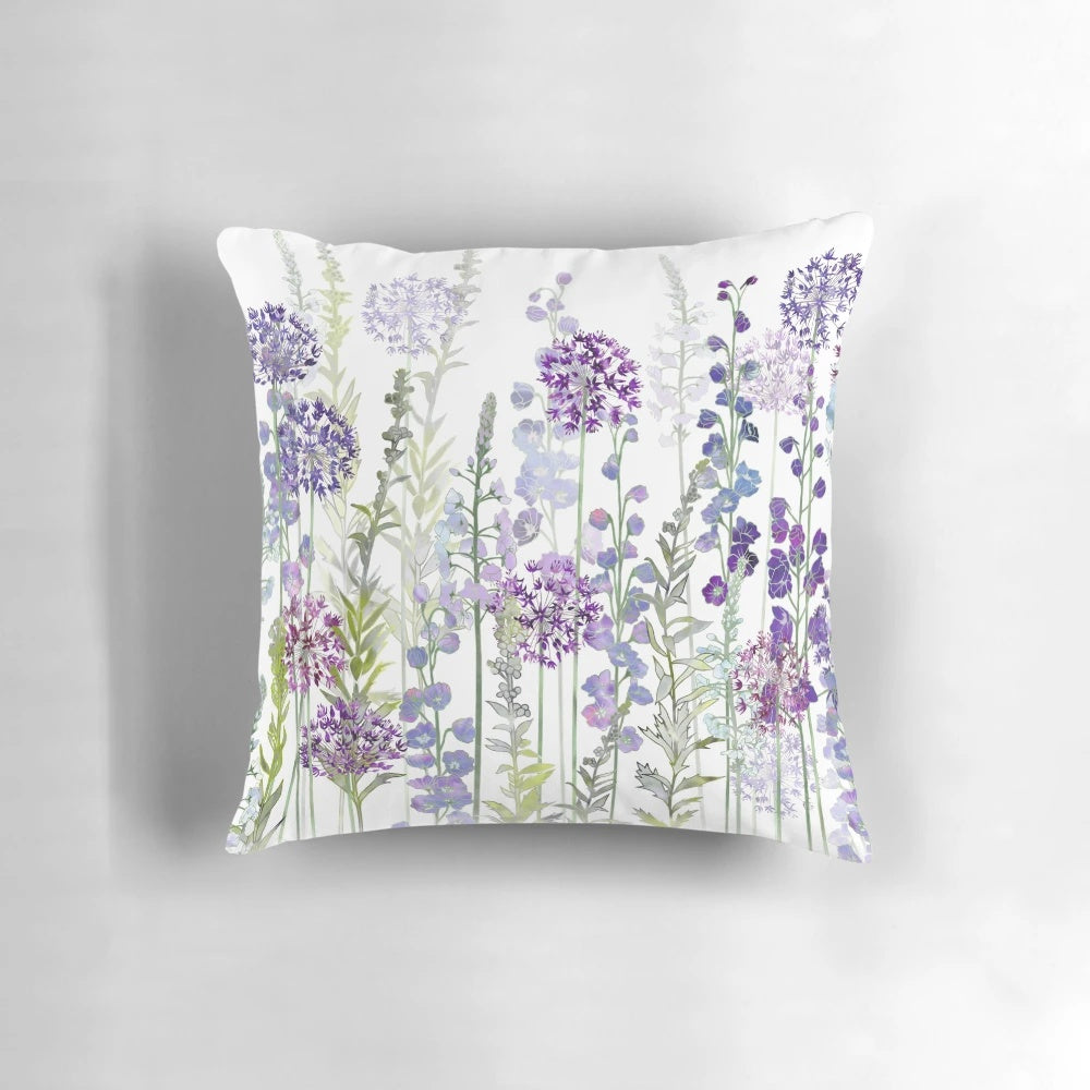 Vibrant purple flower meadow pillow featuring alliums, delphiniums, and veronica gentianoides